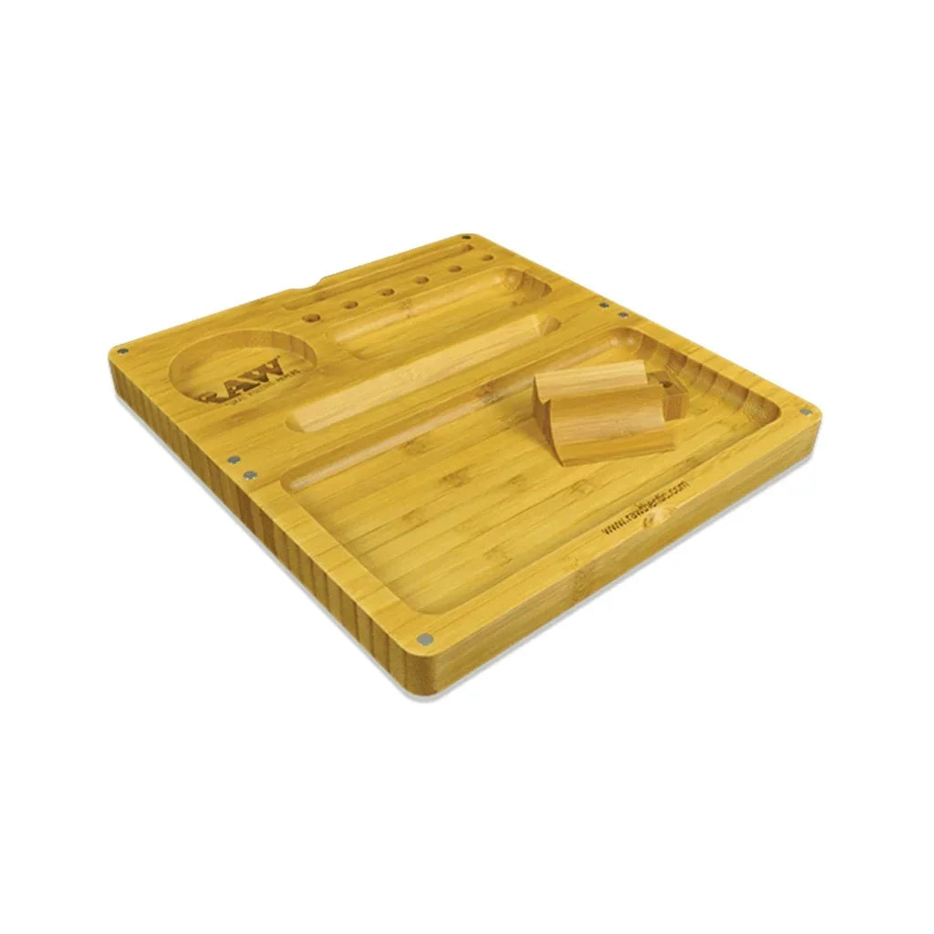 Bamboo rolling tray with compartments and tool holders, RAW logo engraved on surface.