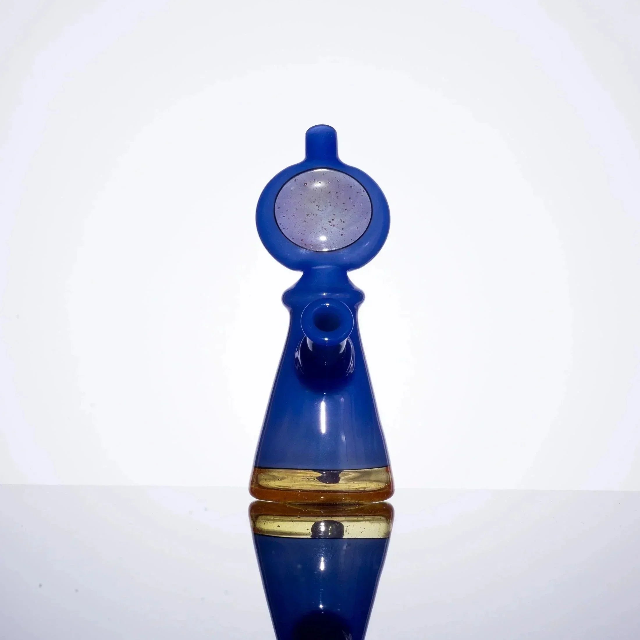 Blue glass bubbler pipe with amber accent and clear percolator, studio shot on white
