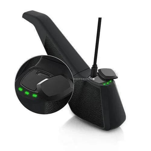 Modern black vaporizer base charging with LED indicator lights and USB cable