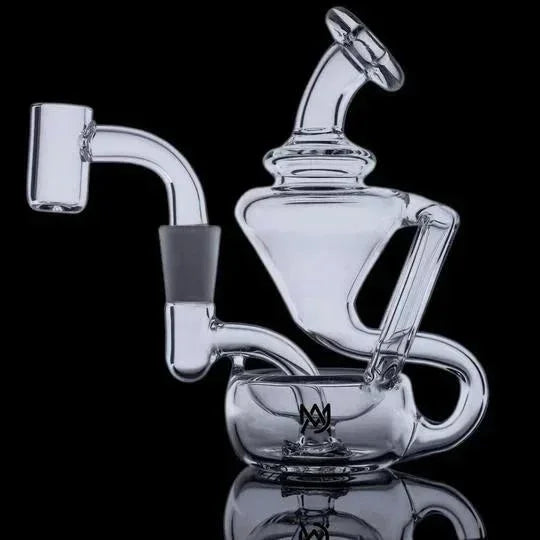 Clear glass recycler dab rig with unique curves and a quartz banger on black background