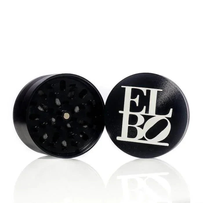 Black Elbo herb grinder with white logo, open to show interior teeth, on reflective surface