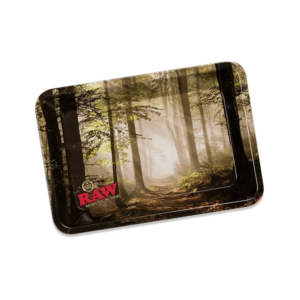 RAW metal rolling tray with forest scene design, used for organizing smoking accessories