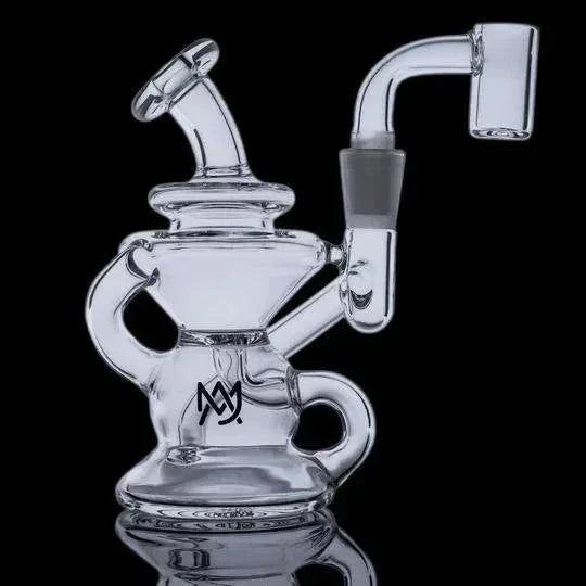 Clear glass recycler dab rig with angled mouthpiece and banger attachment on black background
