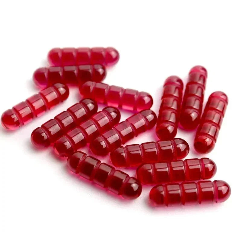 Red glass terp pearls with ridged design for dab rigs, displayed on white background.