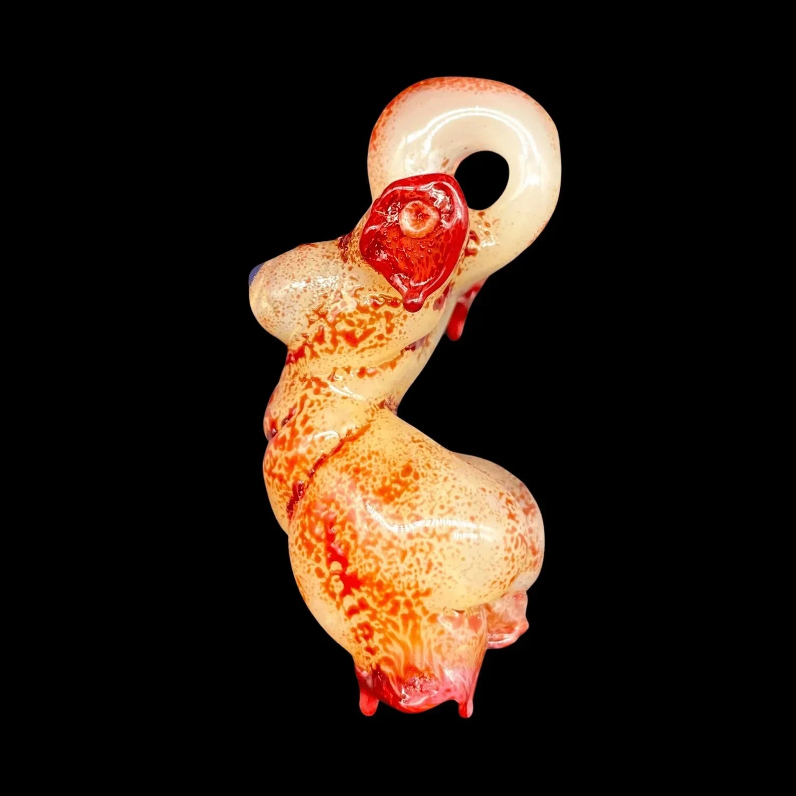 Sculpted glass pipe with red and yellow swirls, unique heady glass art on black background