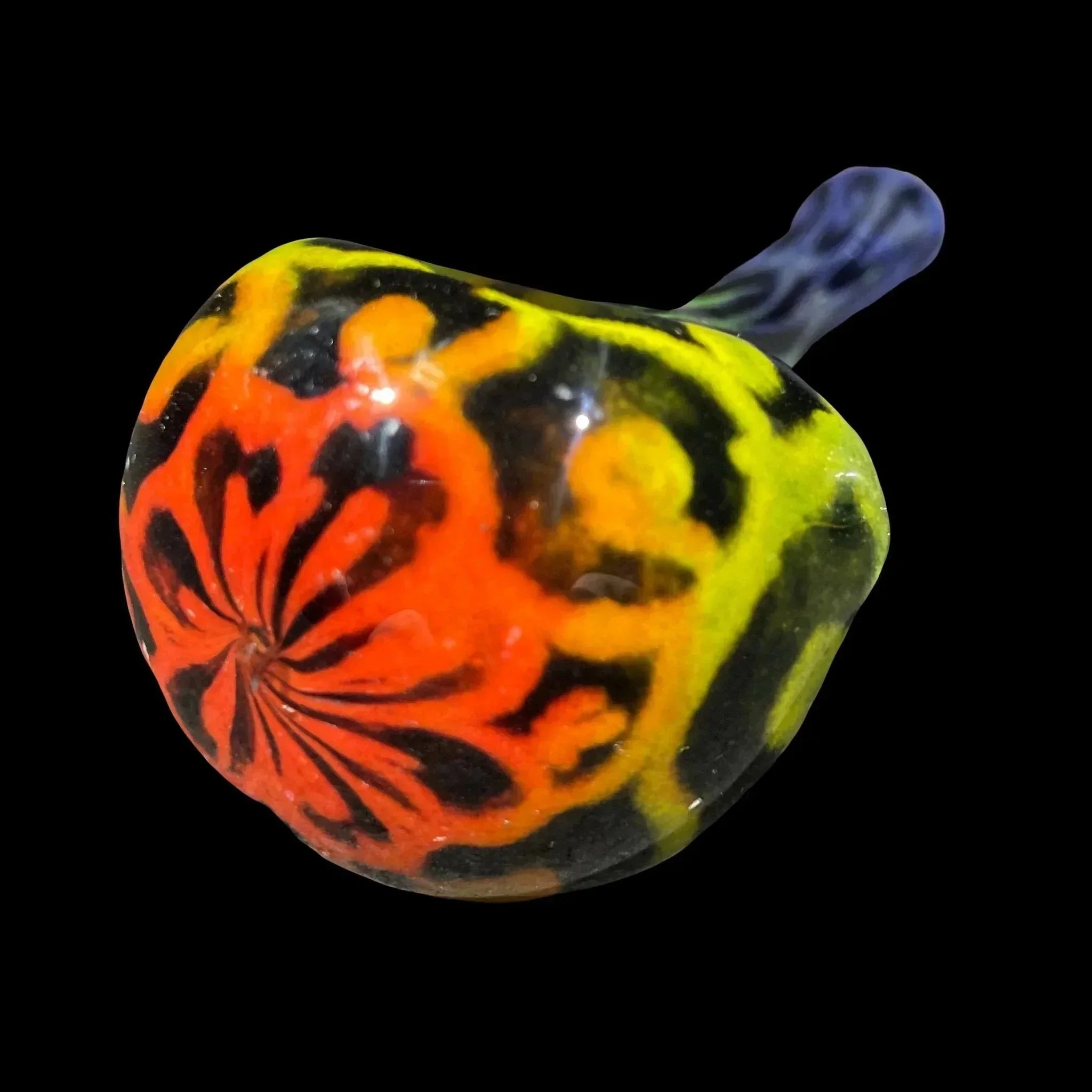 Hand-blown glass pipe with vibrant red, yellow, and black swirl design on black background
