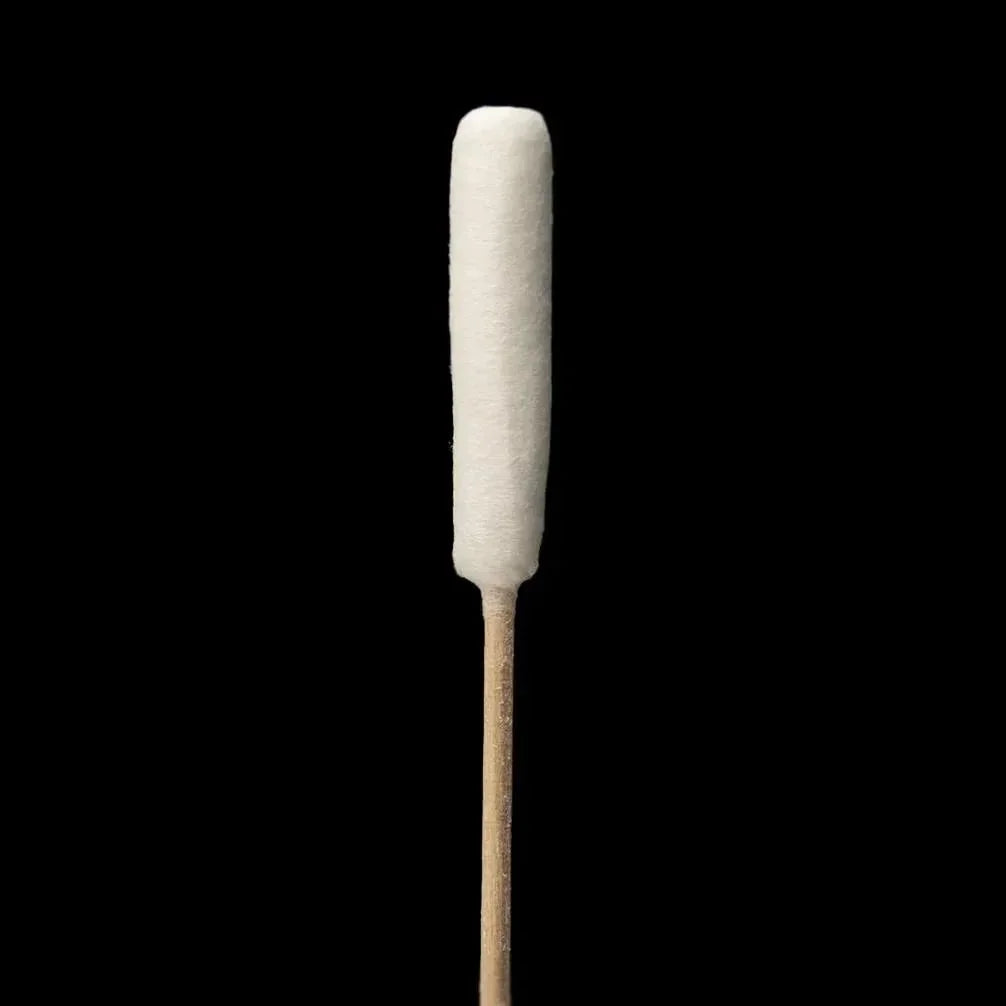 Large cotton cleaning swab with wooden stick on black background, dab tool accessory