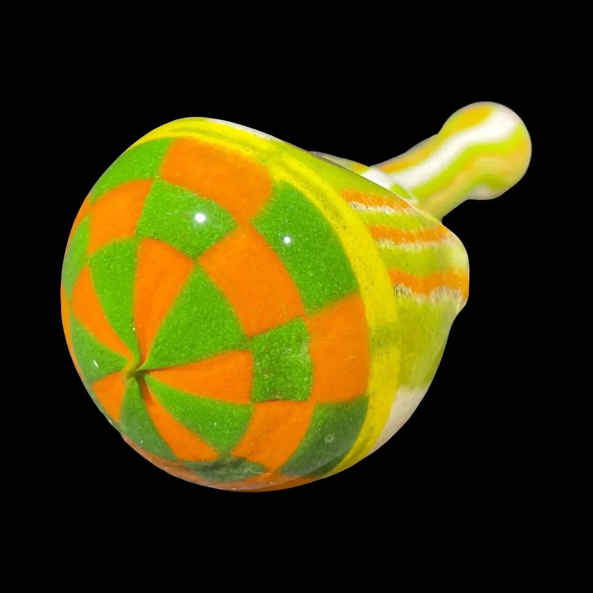 Colorful glass carb cap with orange and green swirl pattern on black background