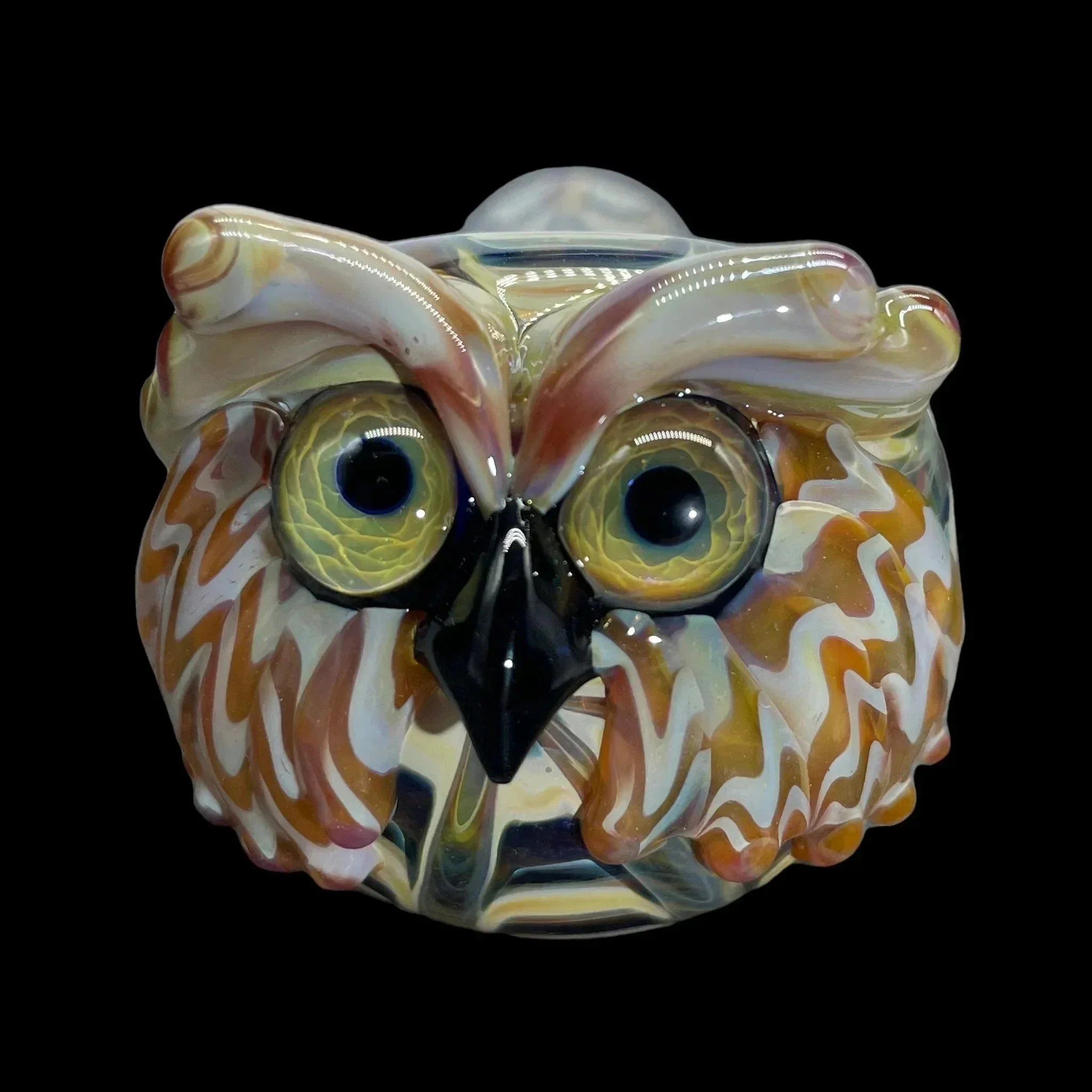 Handcrafted owl glass pipe with detailed eyes and multicolor feather design on black background