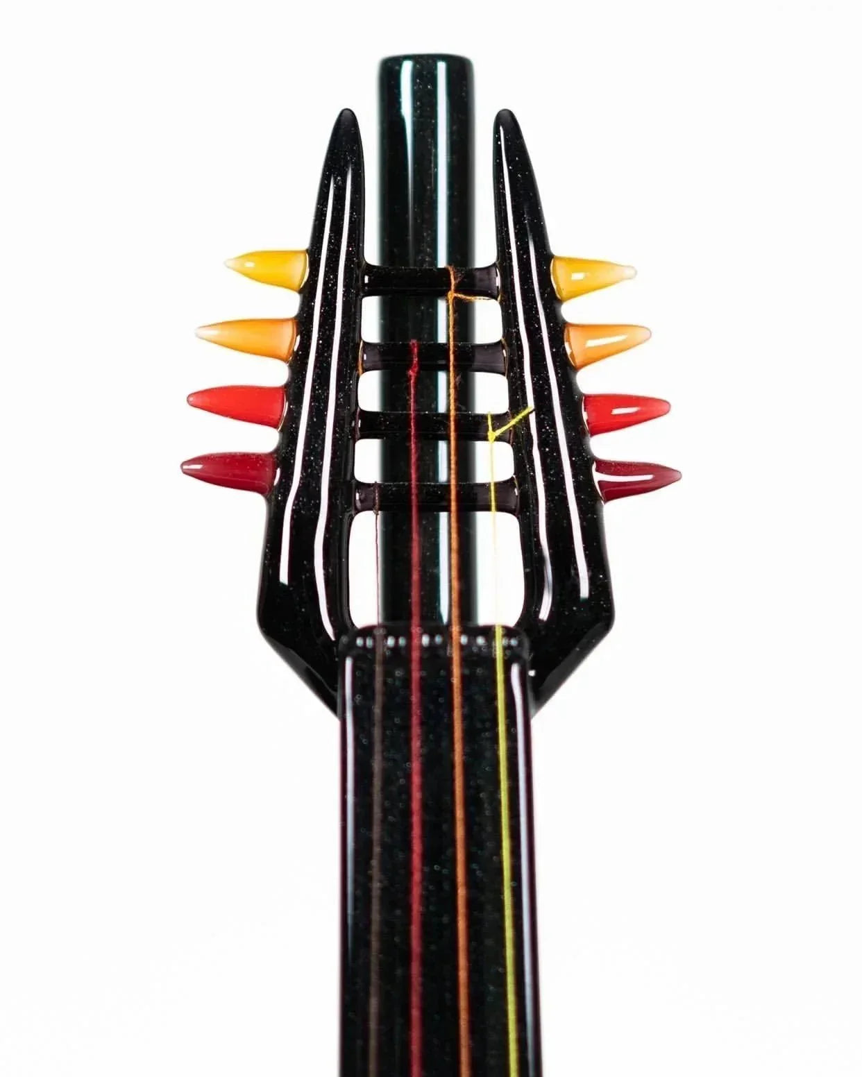 Black glass pipe with colorful spiked accents and striped stem, heady glass art piece