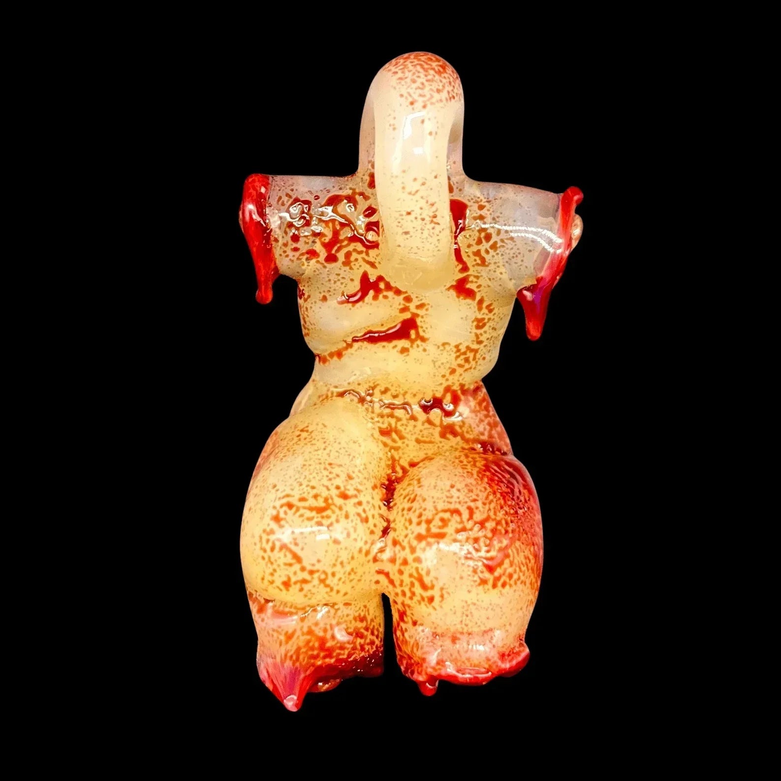 Handcrafted glass pipe shaped like a curvy torso, red and yellow artistic details, black background