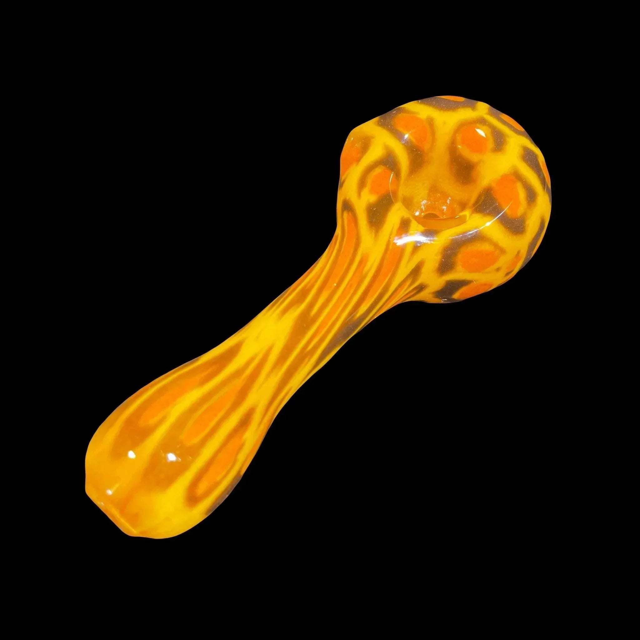 Vibrant orange and yellow glass hand pipe with swirling pattern on a black background