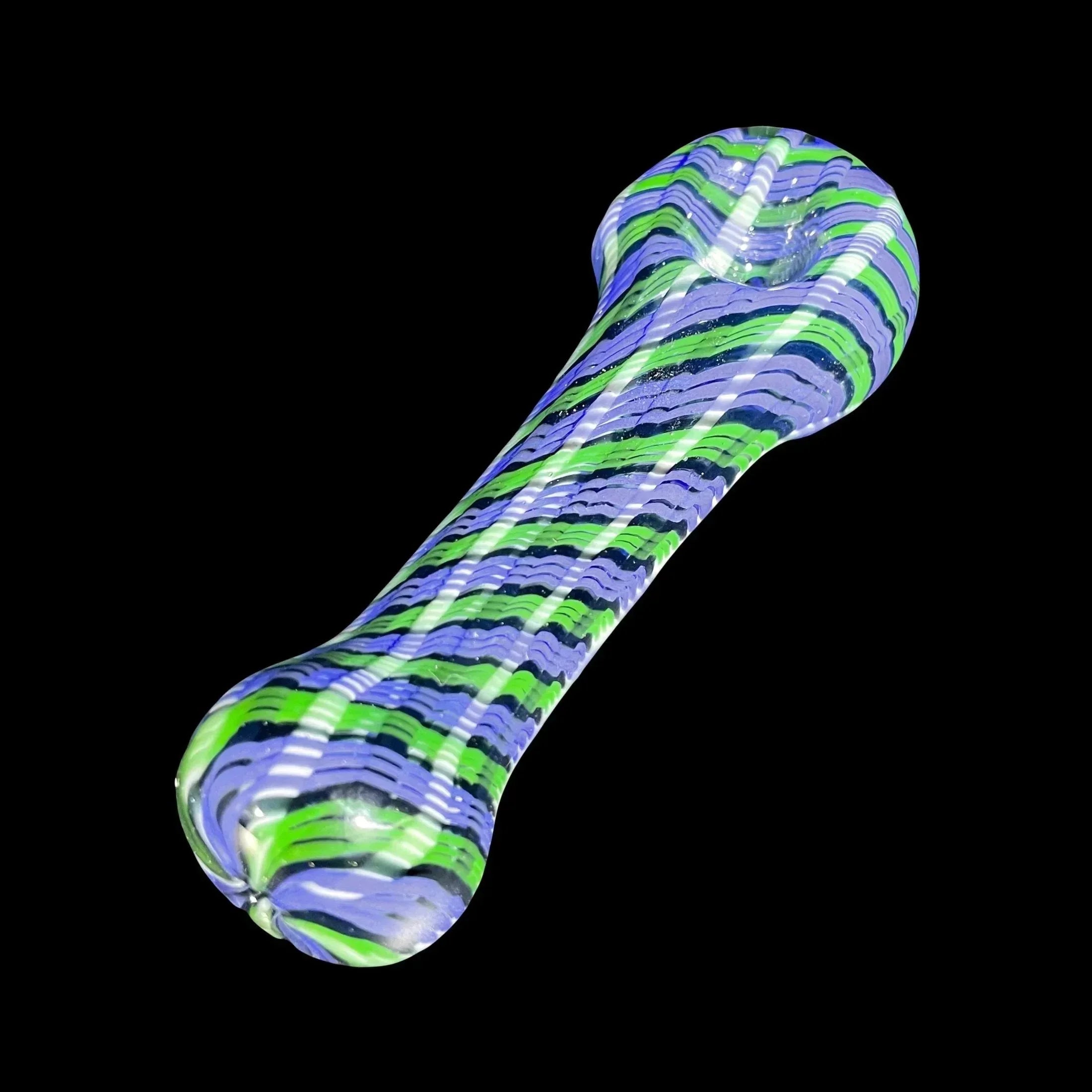 Colorful glass hand pipe with green, purple, and white swirl stripes on a black background