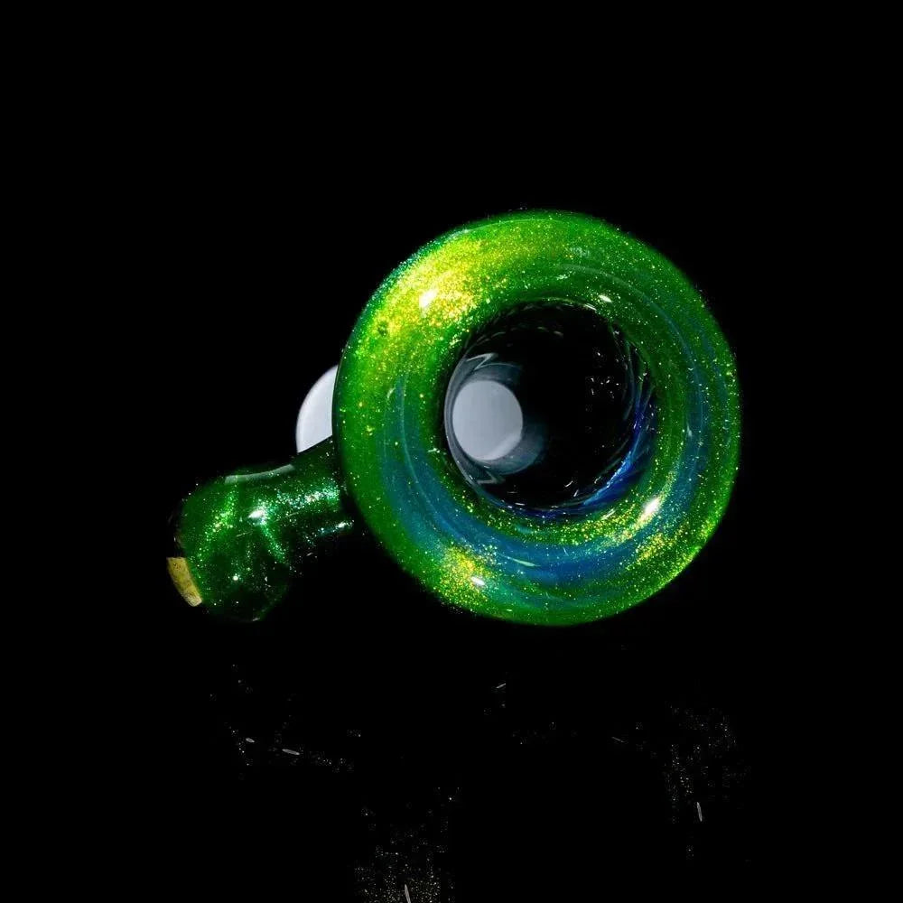 Green glitter glass pipe with a round bowl on a black background