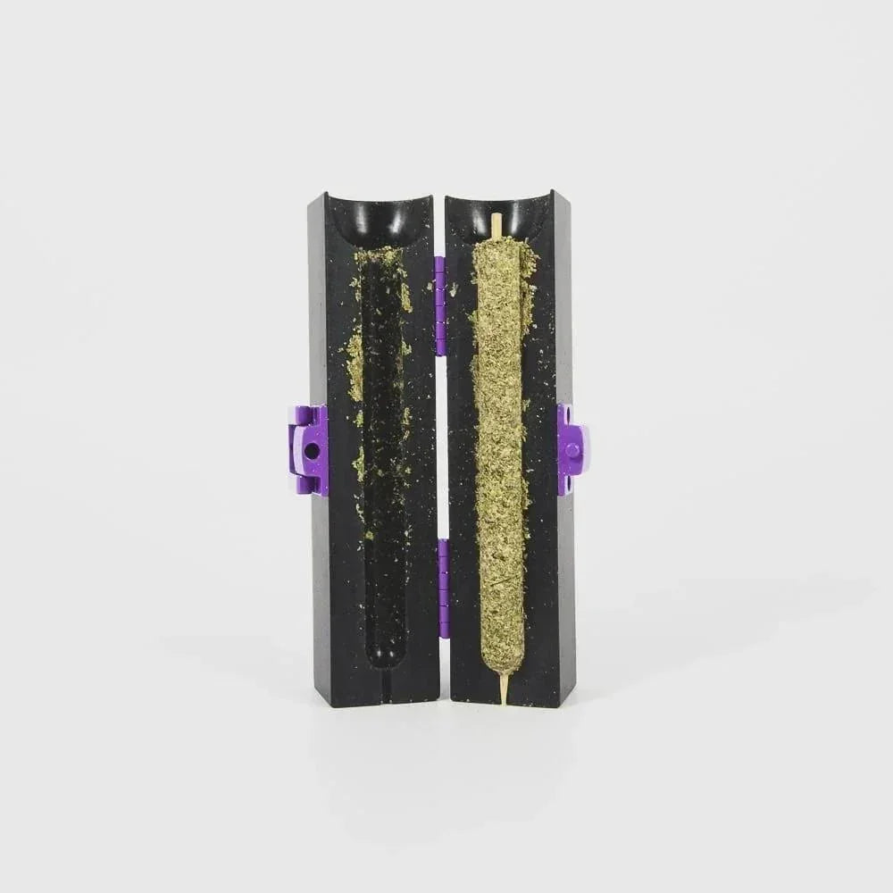 Plastic joint roller mold with herbal blend inside, open and ready for use, isolated on white