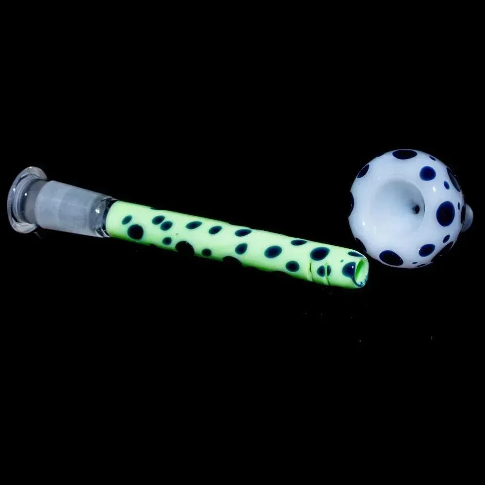 Glow-in-the-dark glass bowl and downstem with black polka dots on black background