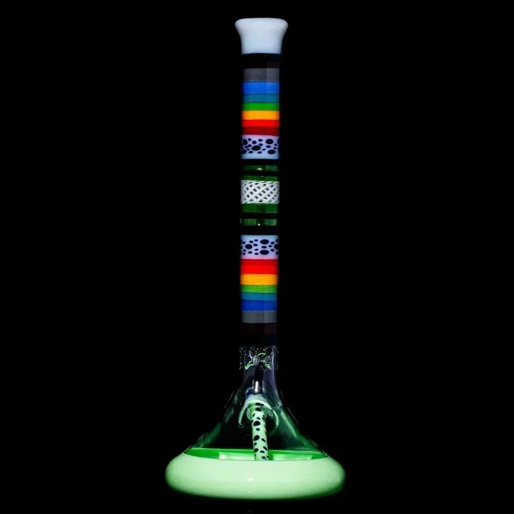 Heady glass water pipe with rainbow stripes, artistic accents, and glow-in-the-dark base