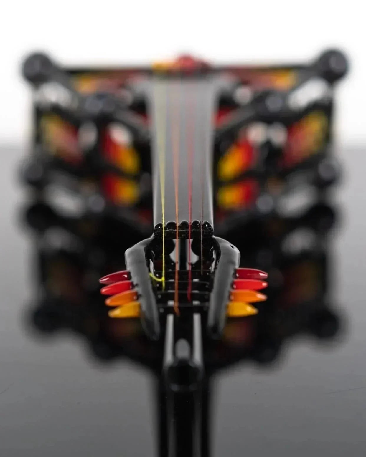 Artistic glass pipe with vibrant red, orange, and yellow accents, showcasing intricate heady glass craftsmanship.