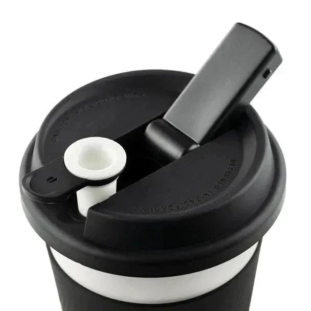 Black portable cup with a built-in black and white ceramic smoking bowl and mouthpiece lid