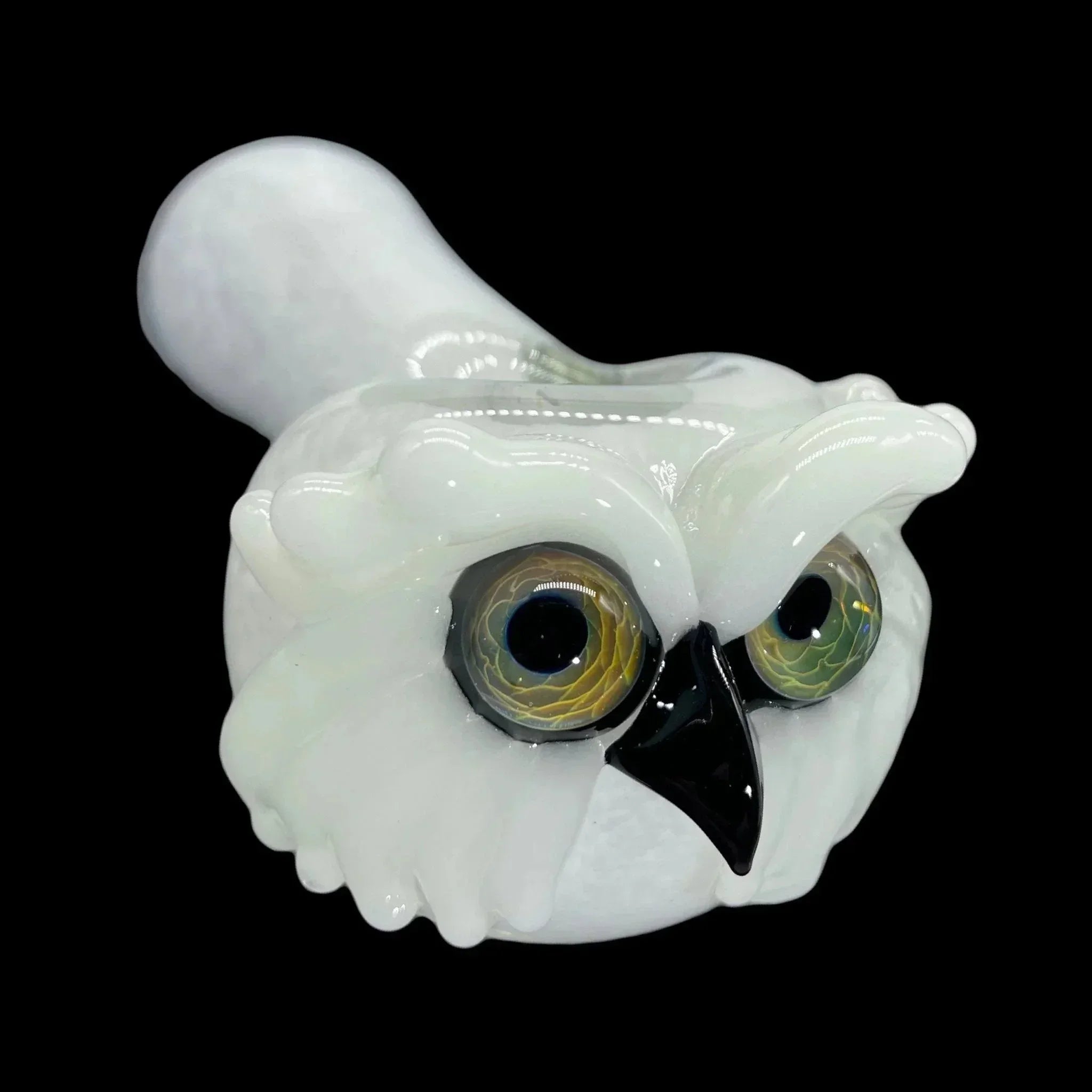 Hand-blown glass owl pipe with detailed eyes and beak on a black background