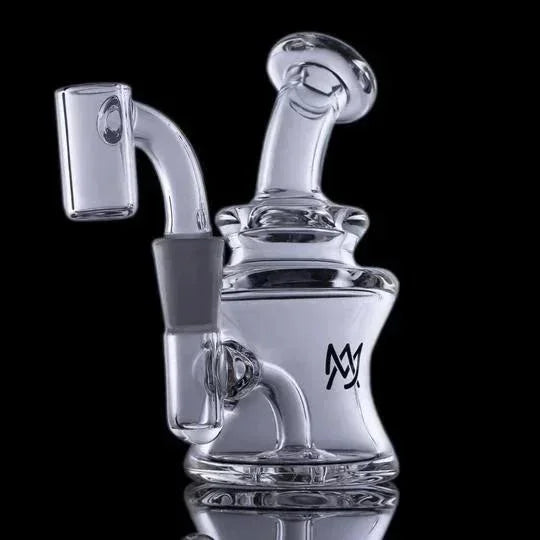 Clear glass dab rig with quartz banger attachment on black background