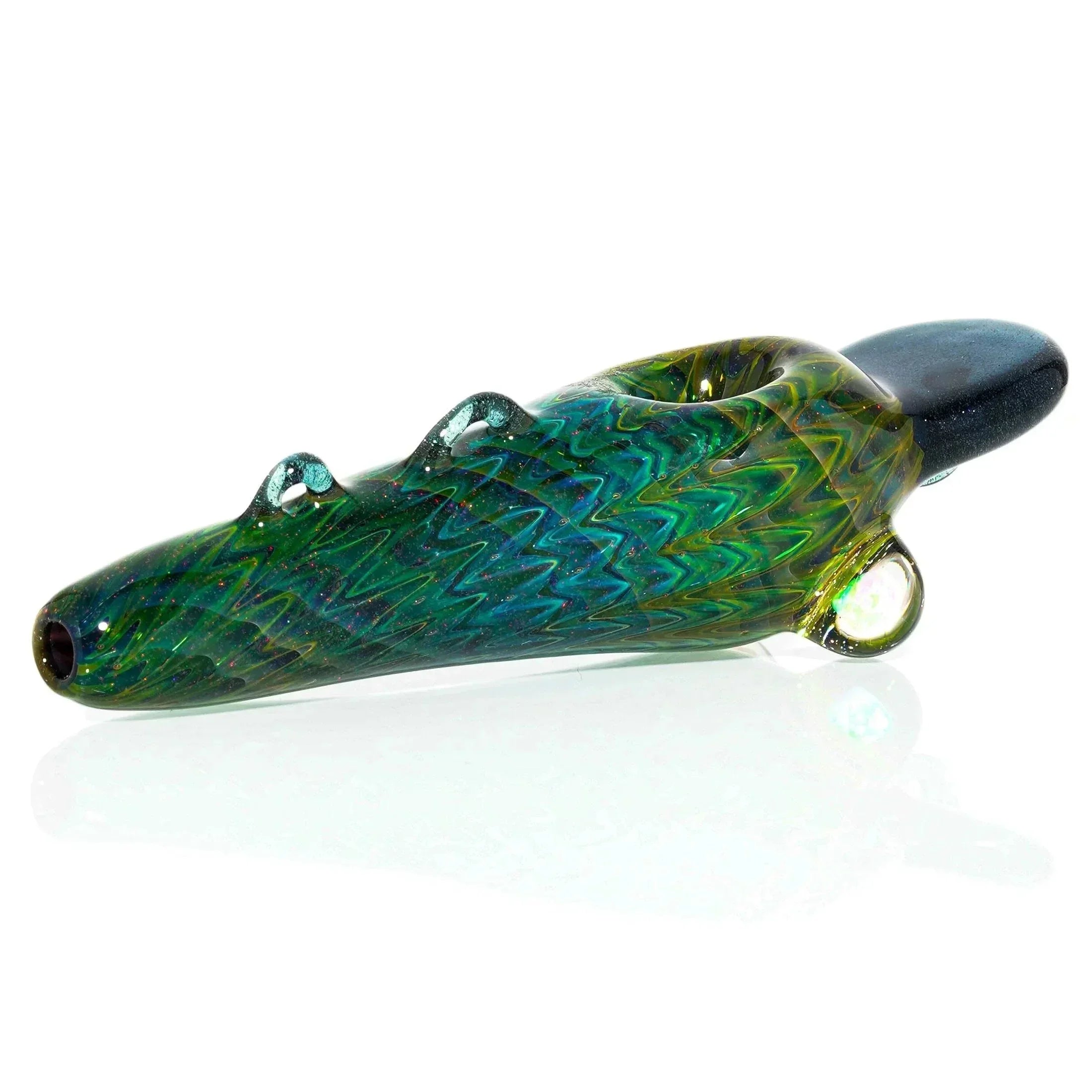 Colorful hand-blown glass spoon pipe with textured details on a white background