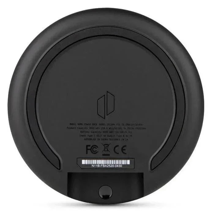Black circular Puffco vaporizer base with regulatory symbols and model details
