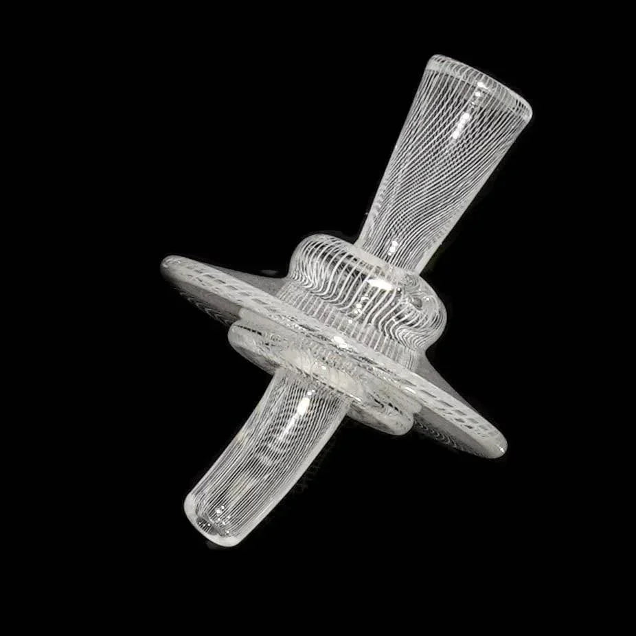Clear glass carb cap with intricate linework design on black background