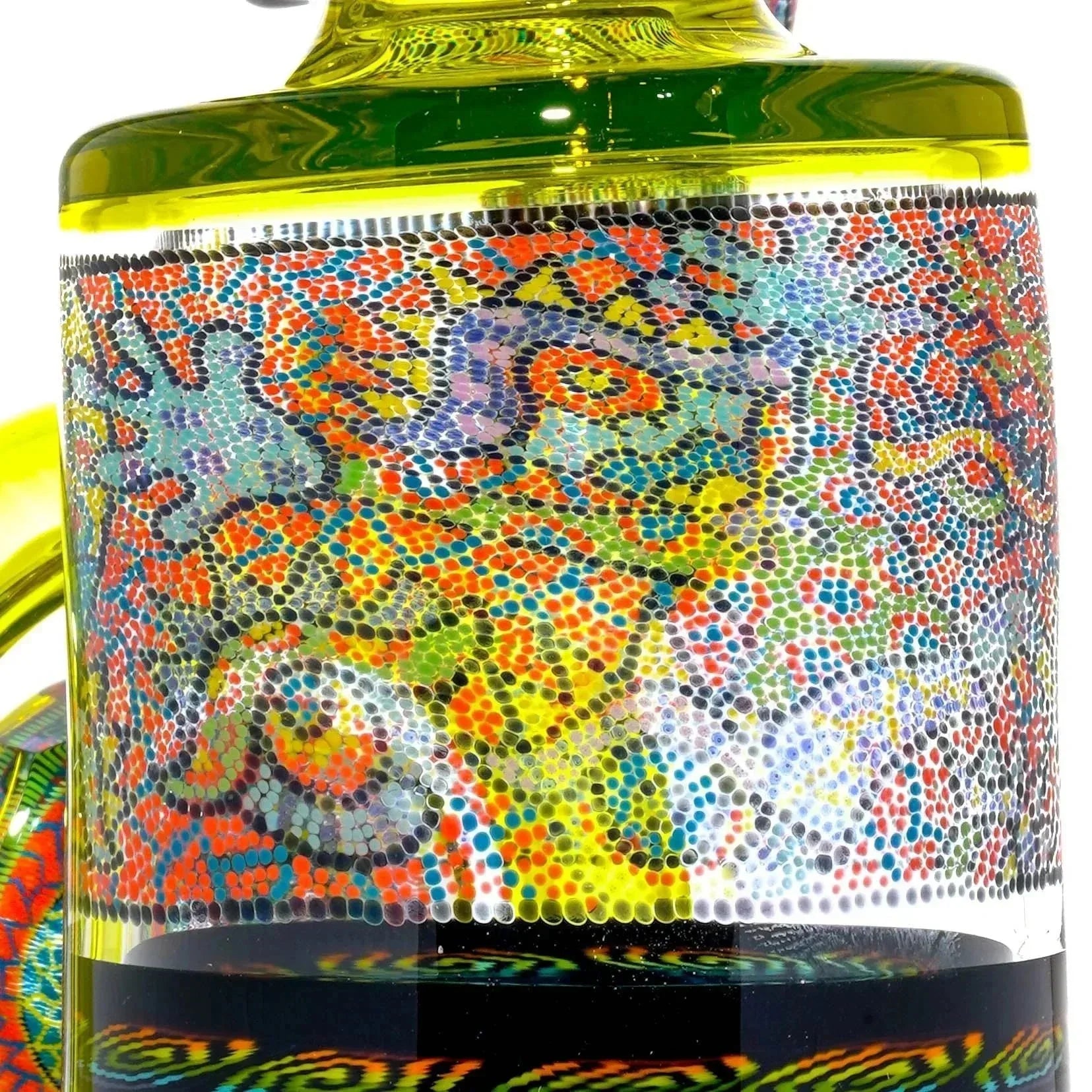 Close-up of a colorful glass water pipe with intricate dot art and vibrant patterns