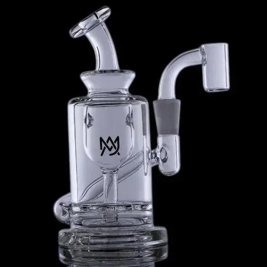 Clear glass dab rig with angled mouthpiece and banger, ideal for concentrates, black background