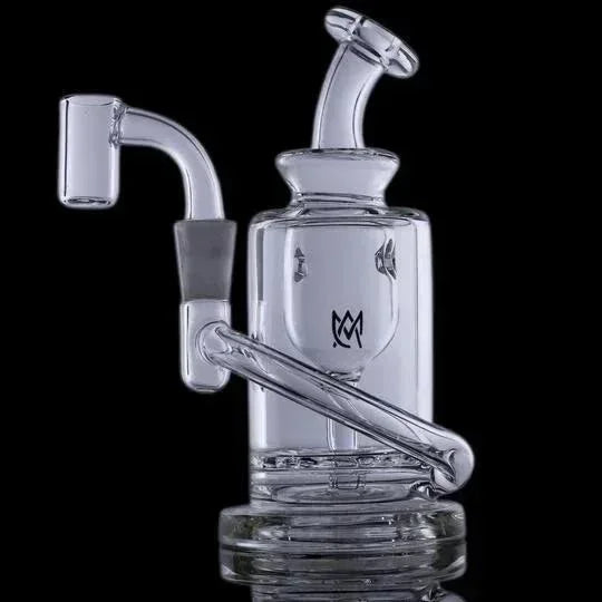 Clear glass recycler dab rig with angled mouthpiece and quartz banger on black background