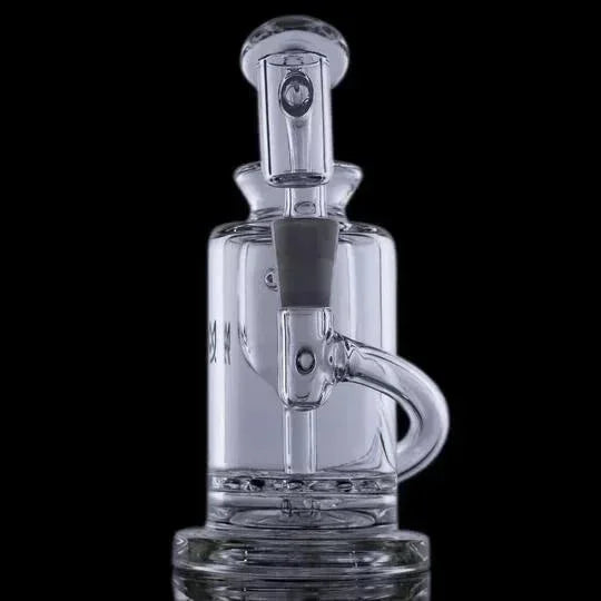 Clear glass water pipe with a cylindrical chamber and angled mouthpiece against black background