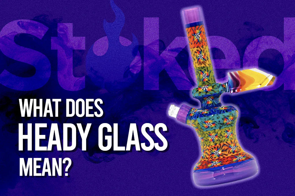 Colorful heady glass water pipe with floral patterns on a purple background, text asking meaning of heady glass