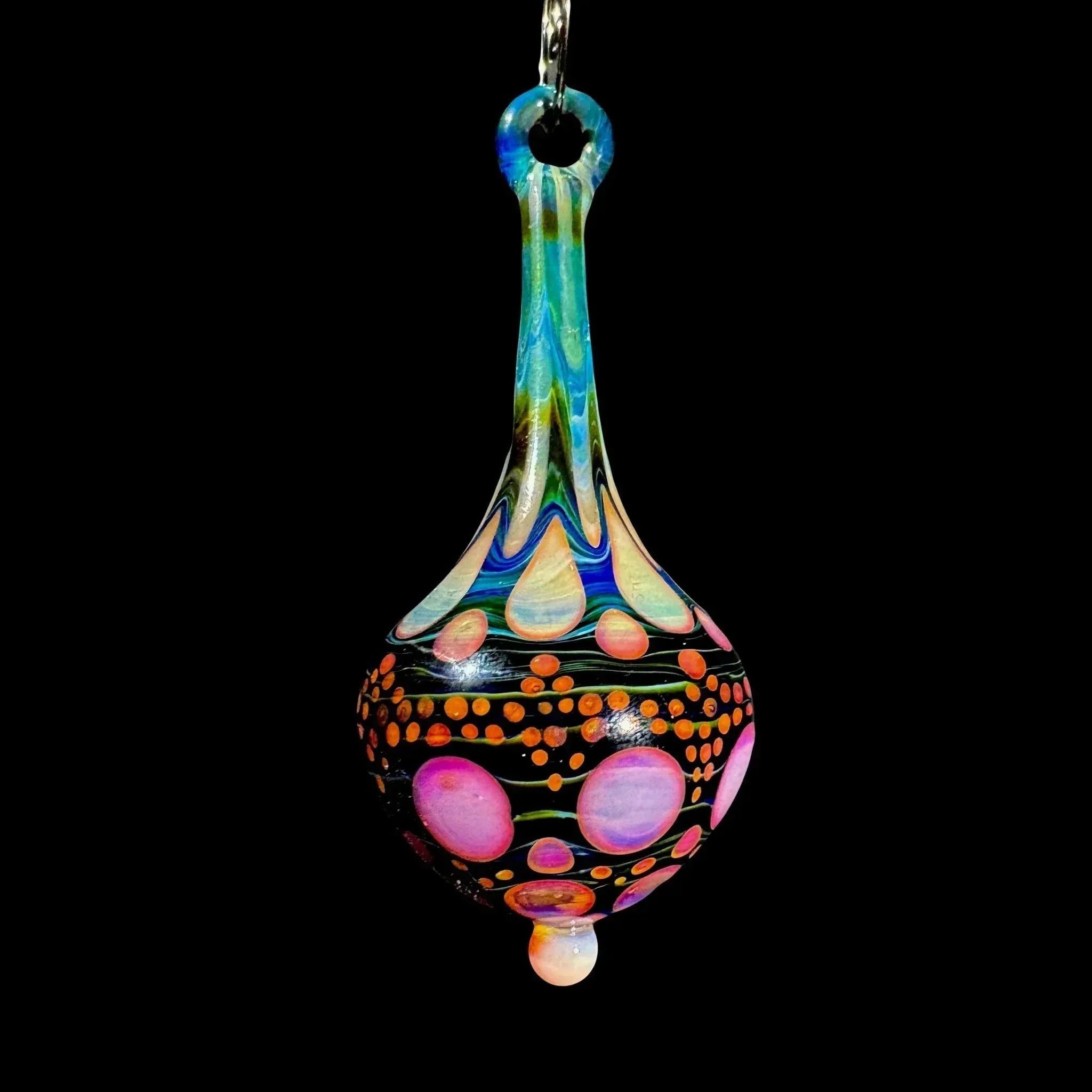 Colorful heady glass pendant with psychedelic patterns on black background
