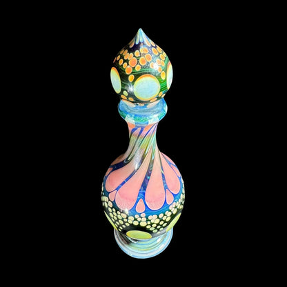 Heady glass art bottle with colorful swirls, marbles, and intricate dot patterns on black background.