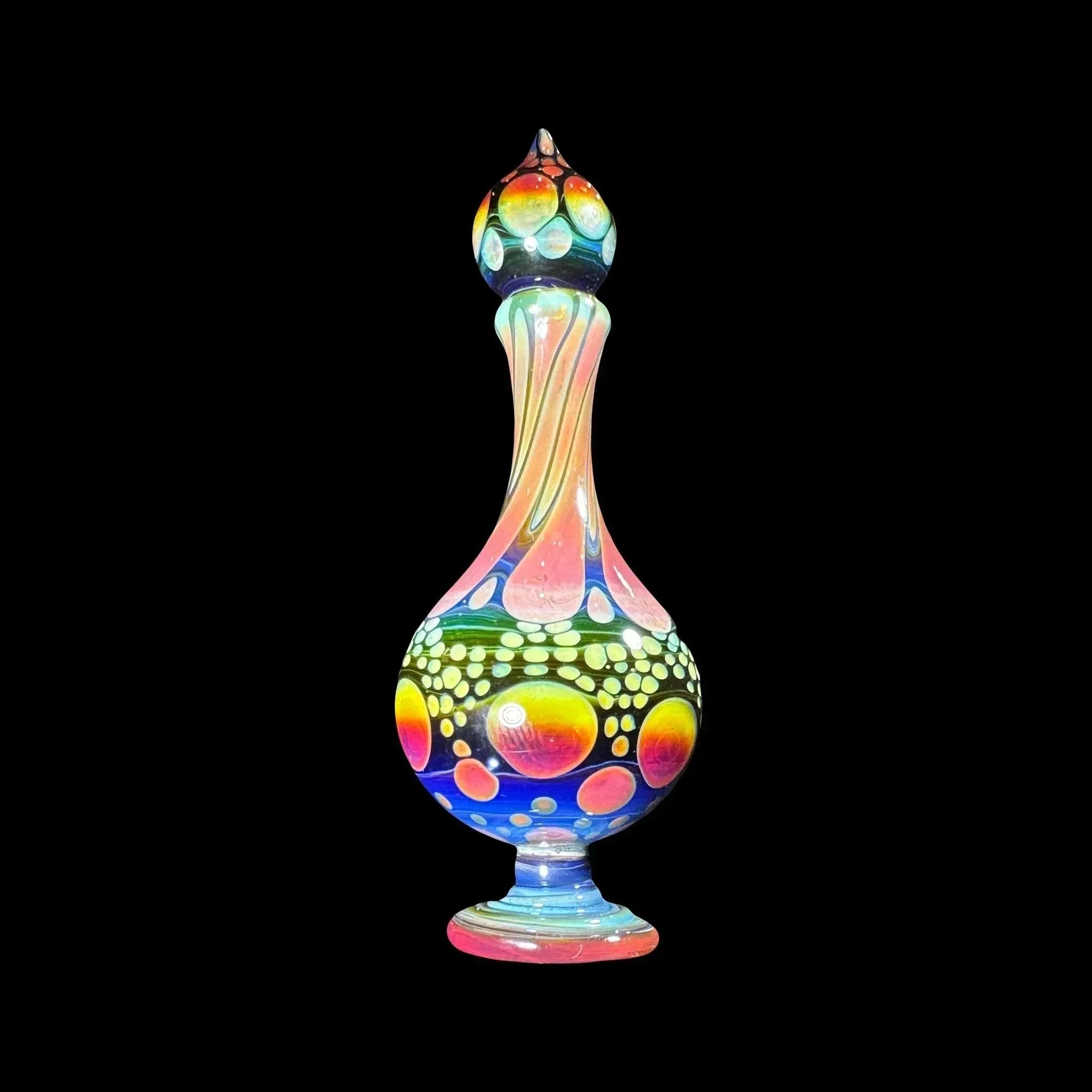 Colorful heady glass art piece with intricate patterns on a black background