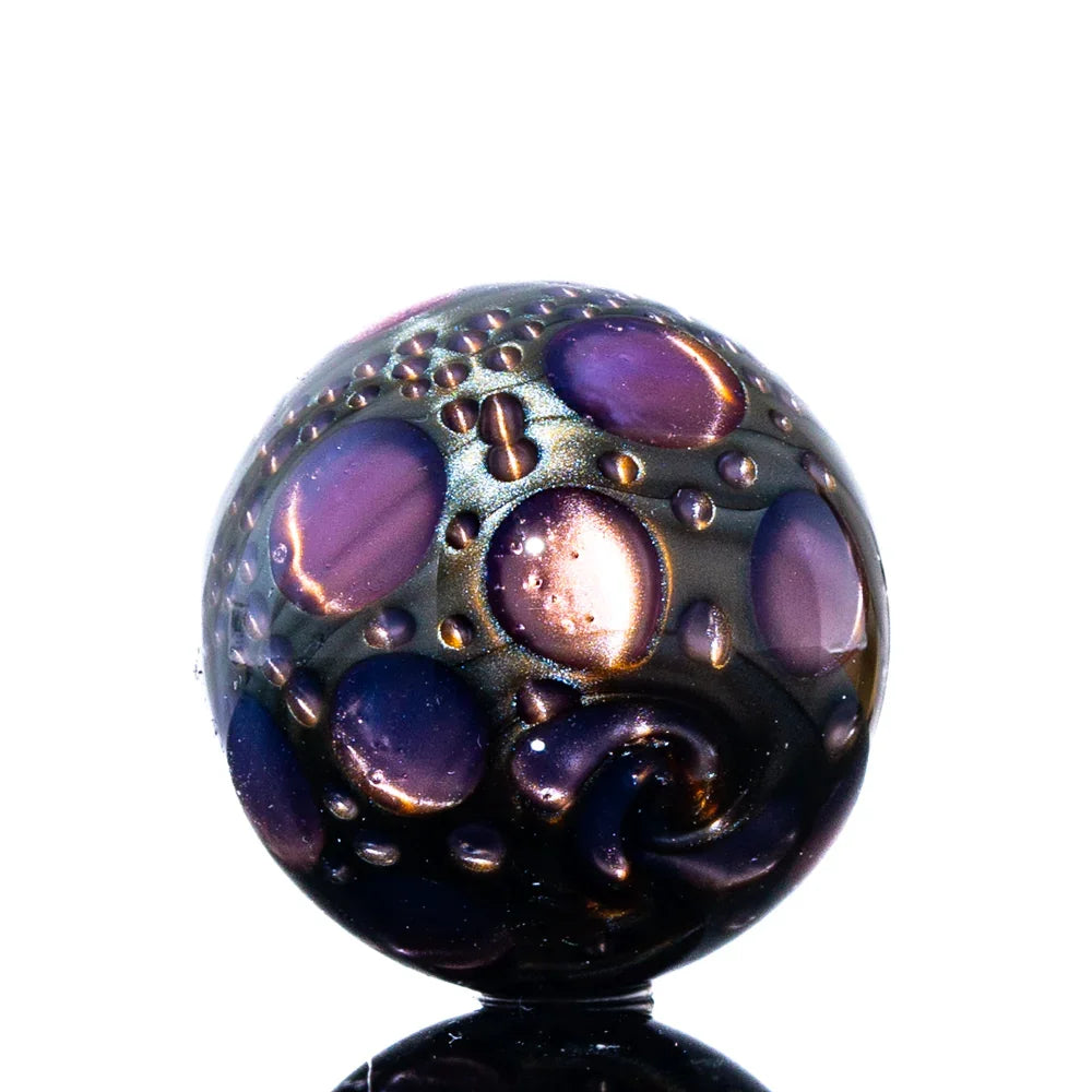 Purple glass marble with textured, bubble-like pattern for smoking accessory