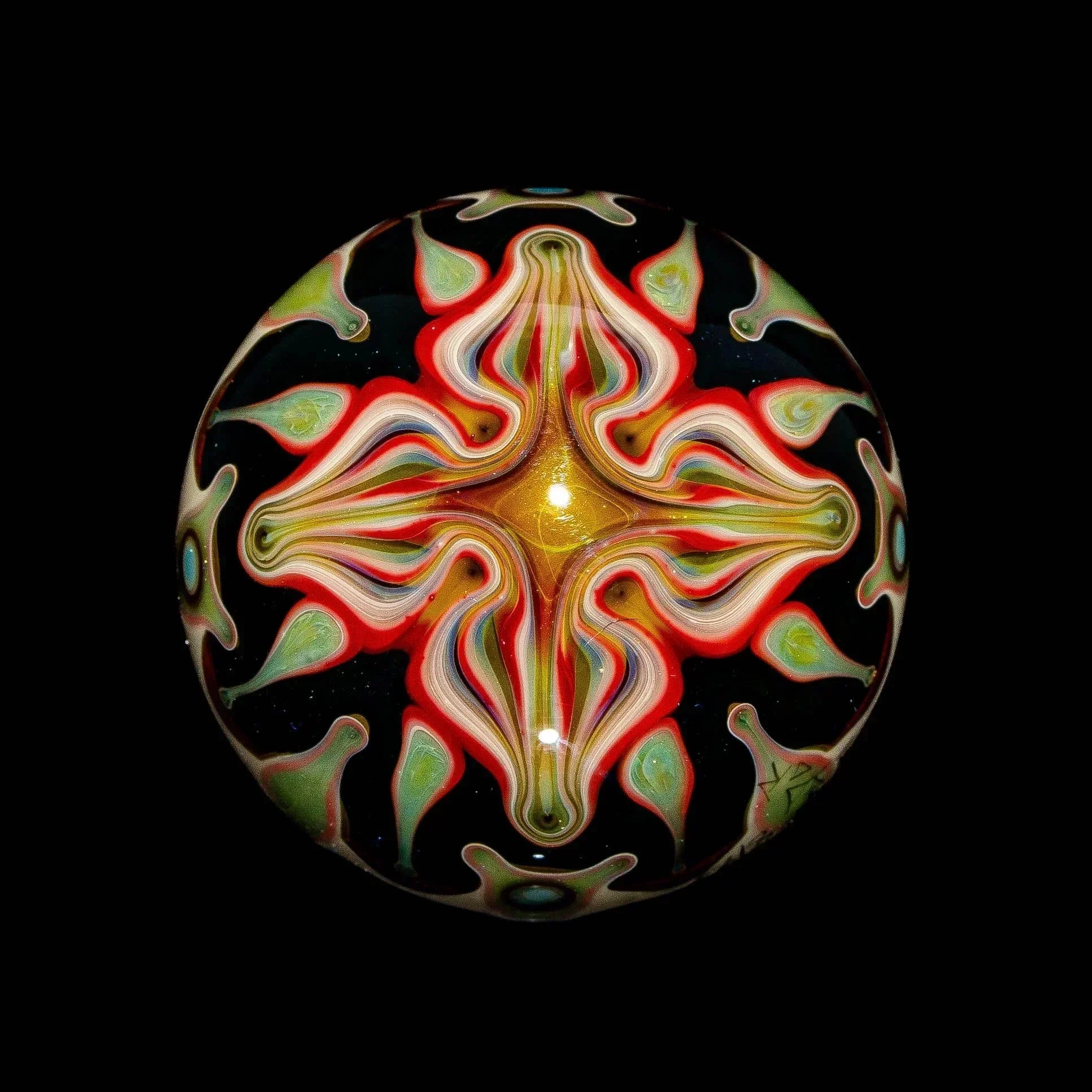 Heady glass marble with psychedelic swirling patterns and vibrant colors on a black background