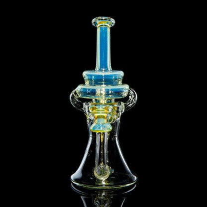 Heady glass water pipe with blue and yellow accents on a black background