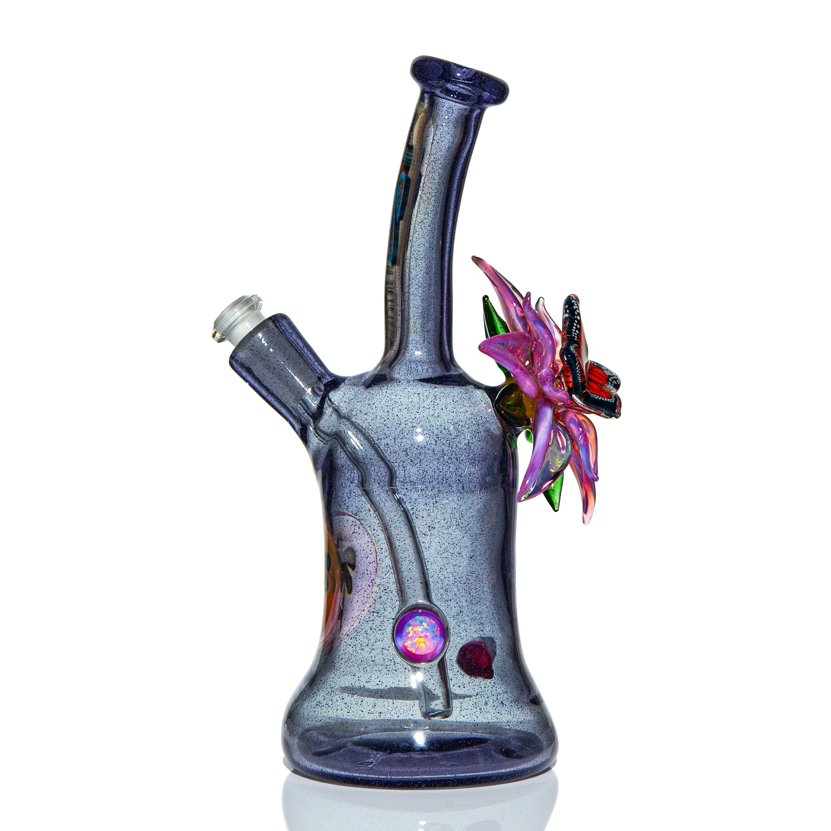 Handcrafted glass water pipe with purple body, decorative flower, and butterfly accent