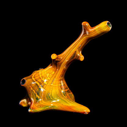 Heady glass hand pipe with vibrant orange and yellow colors, artistic tree branch design