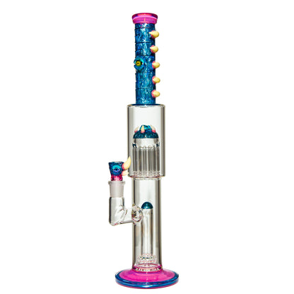 Heady glass bong with blue monster-themed accents, clear chamber, and pink highlights