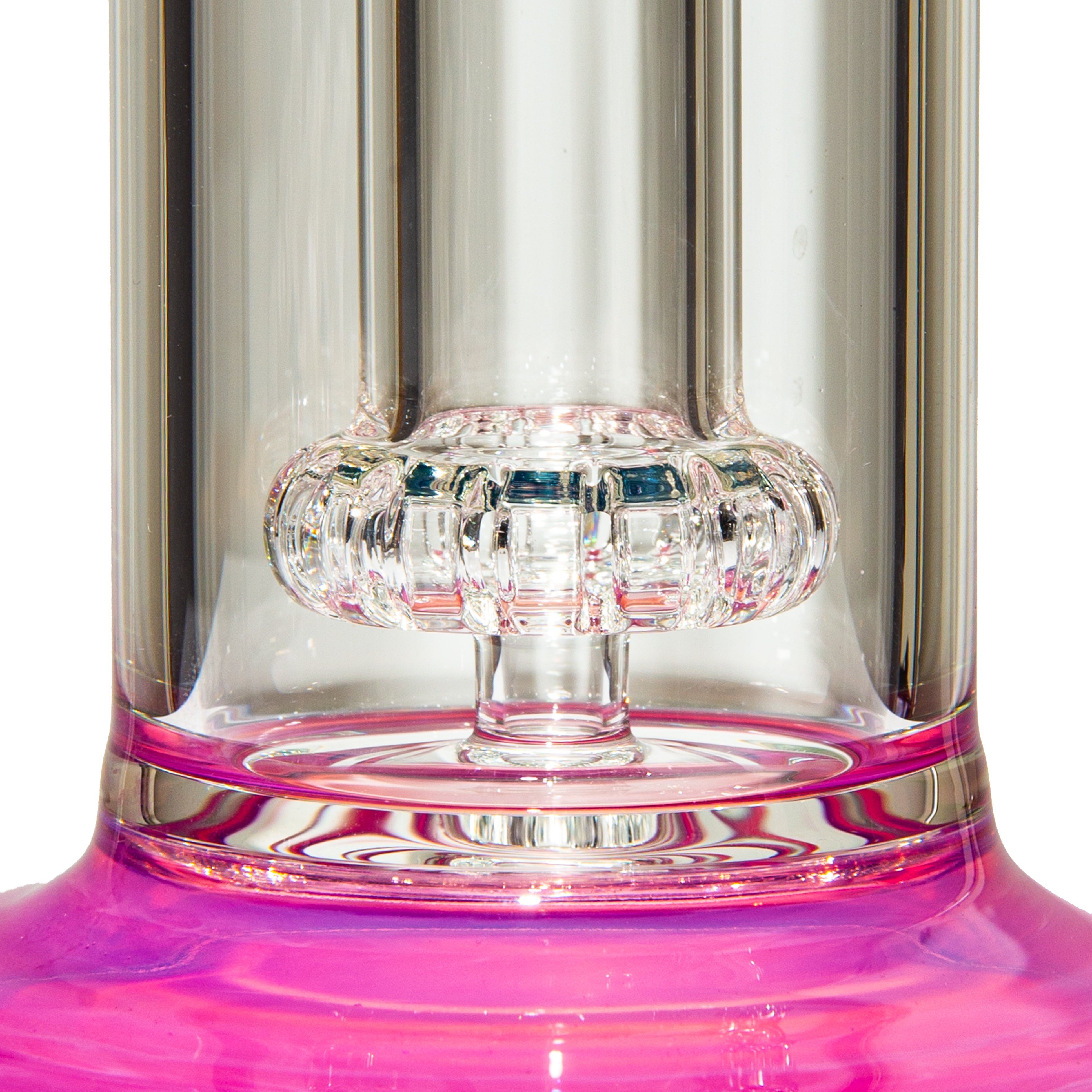 Close-up of clear glass water pipe base with pink accents and intricate percolator design
