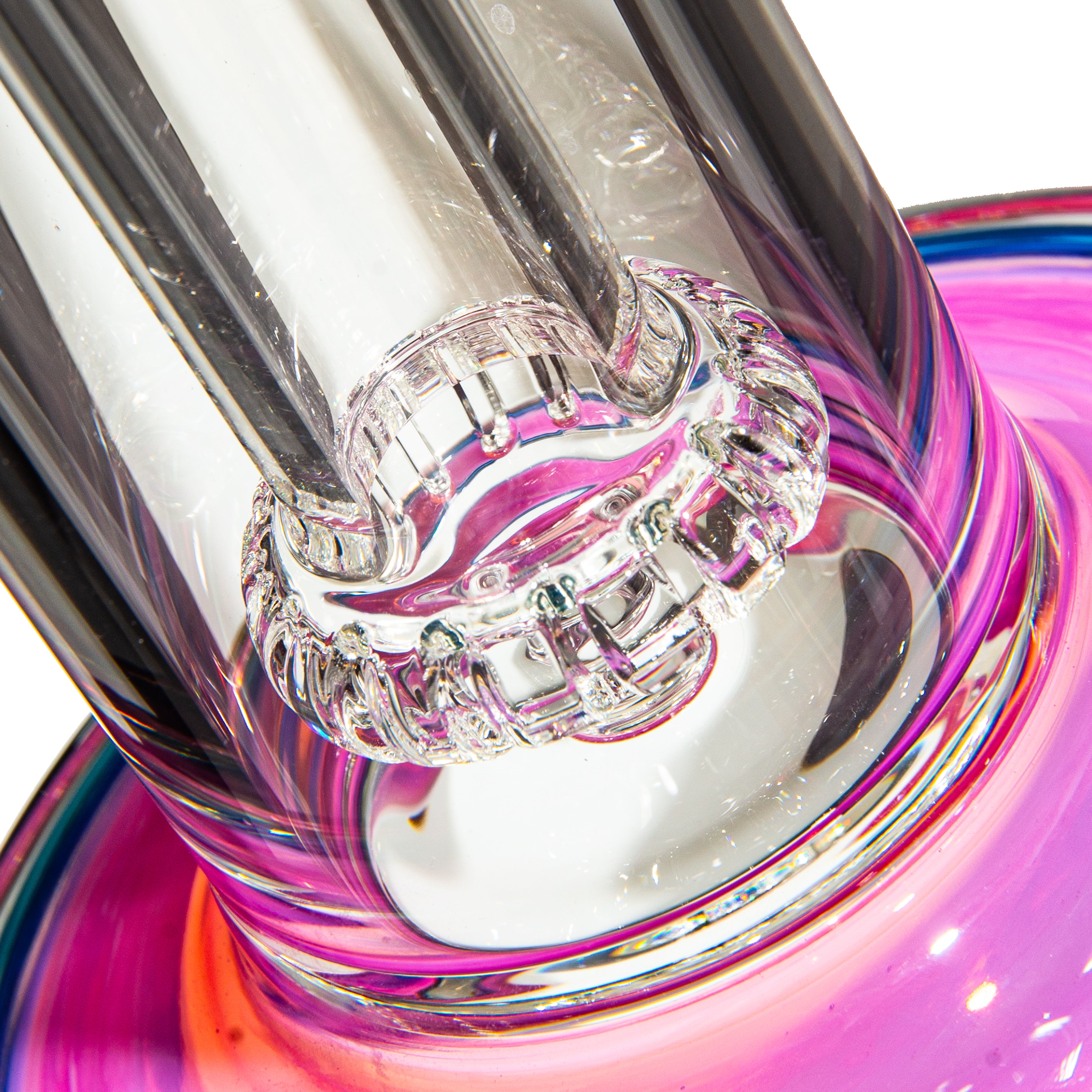 Close-up of intricate glass water pipe base with vibrant pink and orange accents