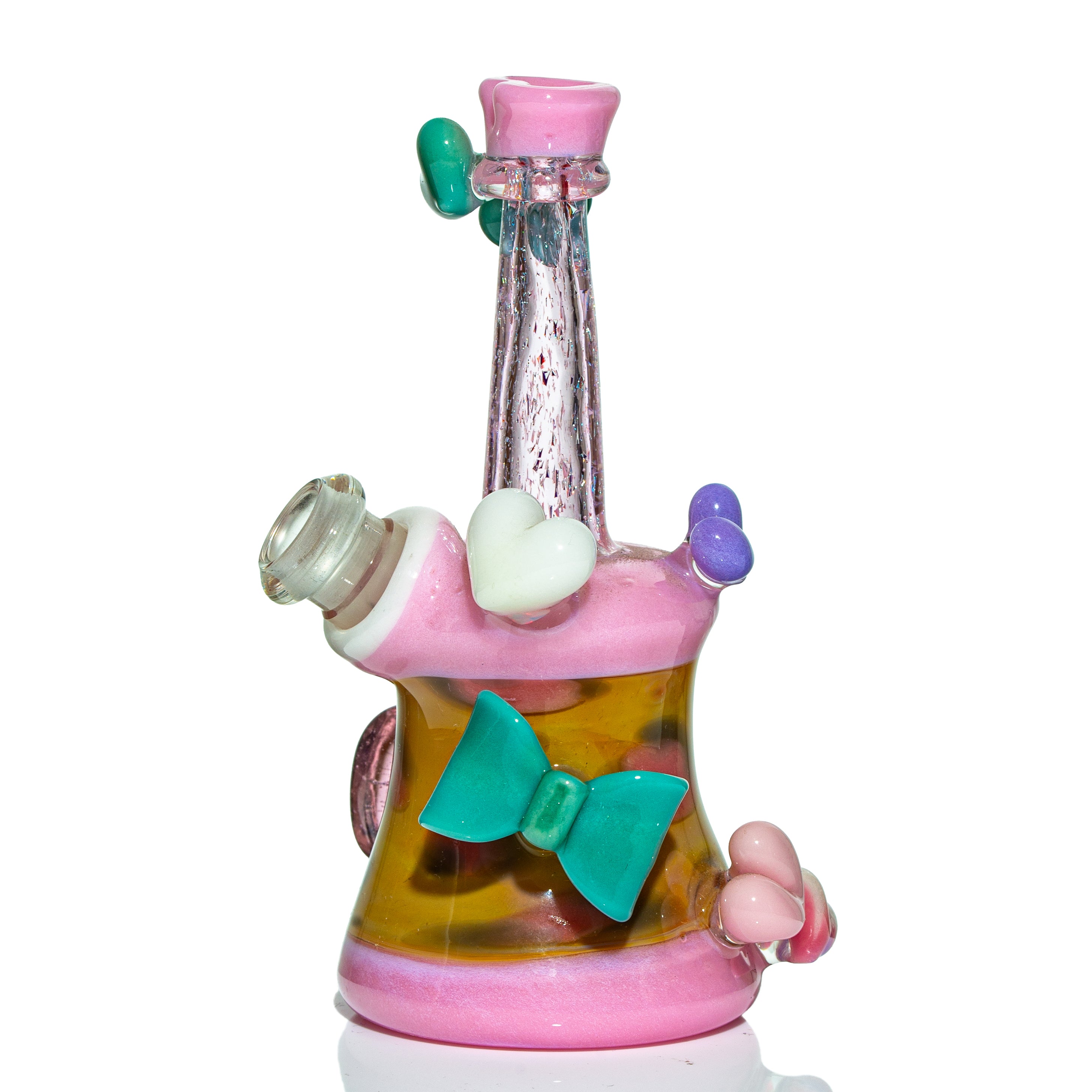 Colorful heady glass water pipe with pink, yellow, and teal bow accents on white background