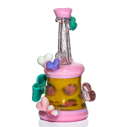 Colorful heady glass water pipe with heart accents, pink and yellow, for smoking accessories.