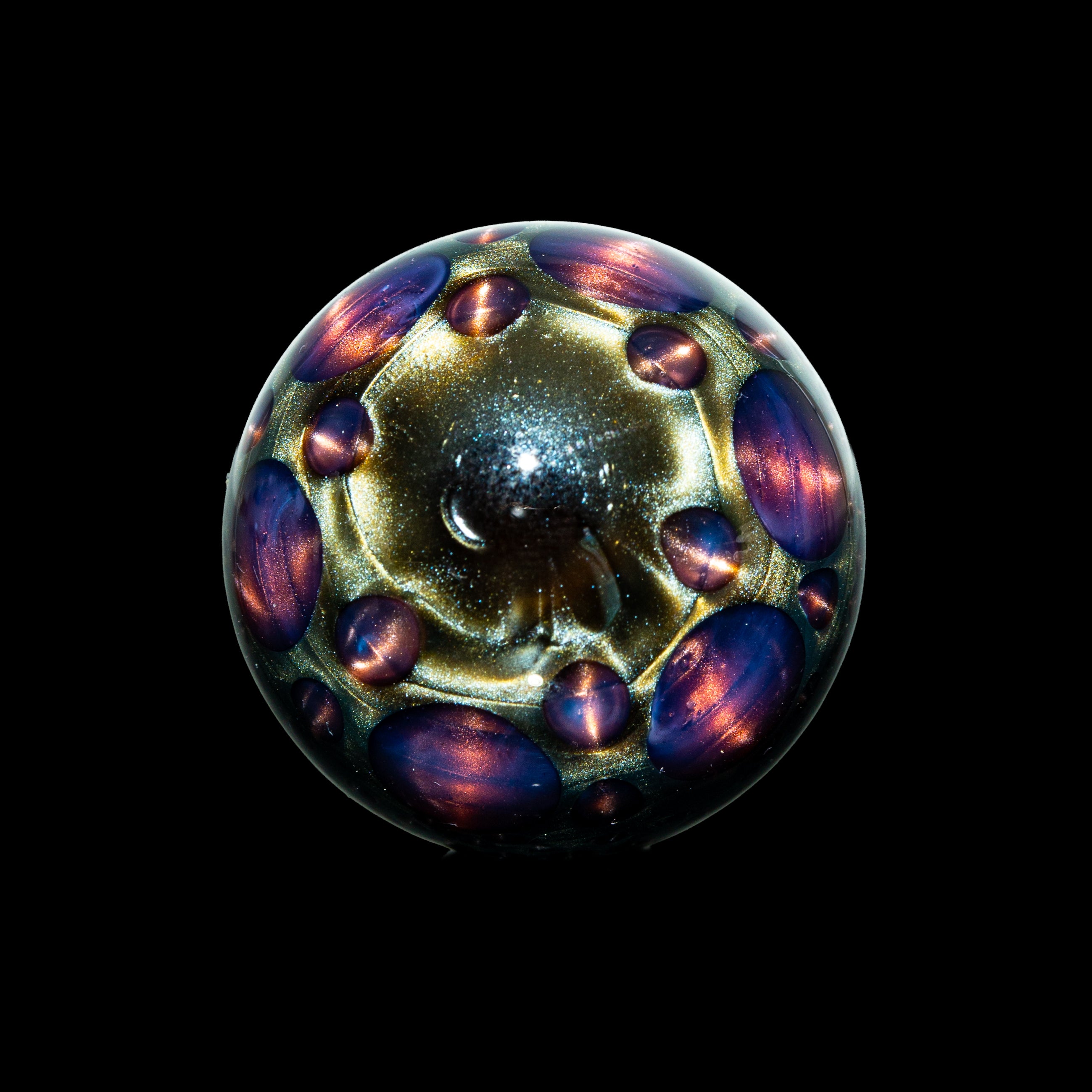 Handcrafted glass marble with iridescent, space-themed design and metallic accents