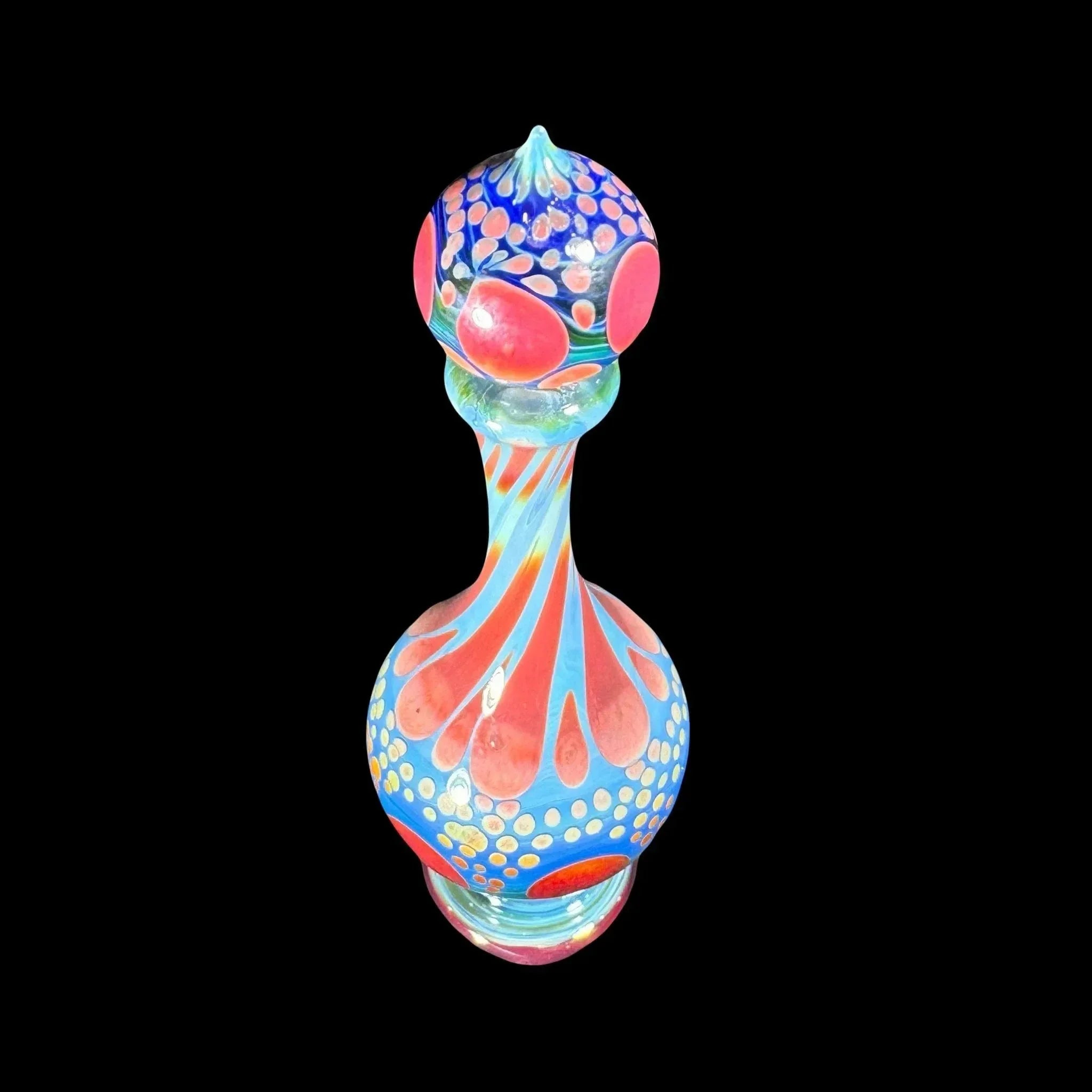 Colorful heady glass art piece with vibrant blue, pink, and orange patterns on black background
