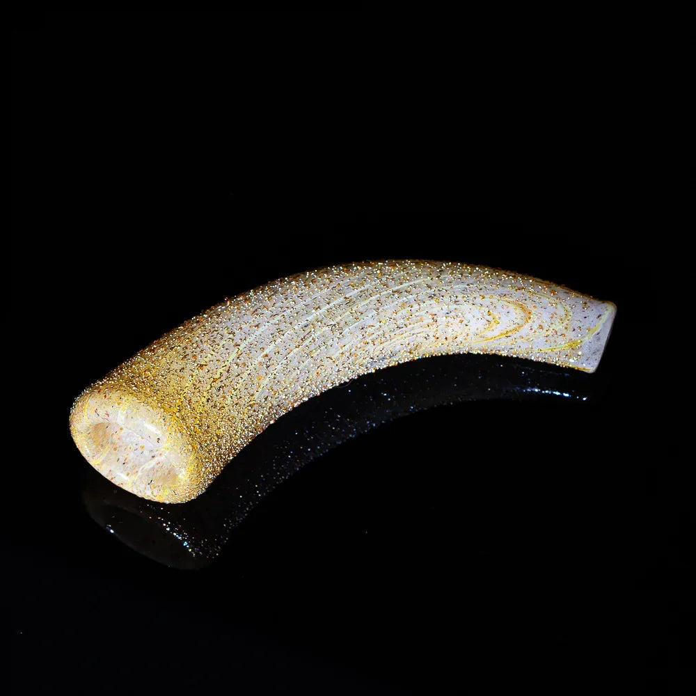Curved glittery glass smoking pipe with gold accents on a black reflective background