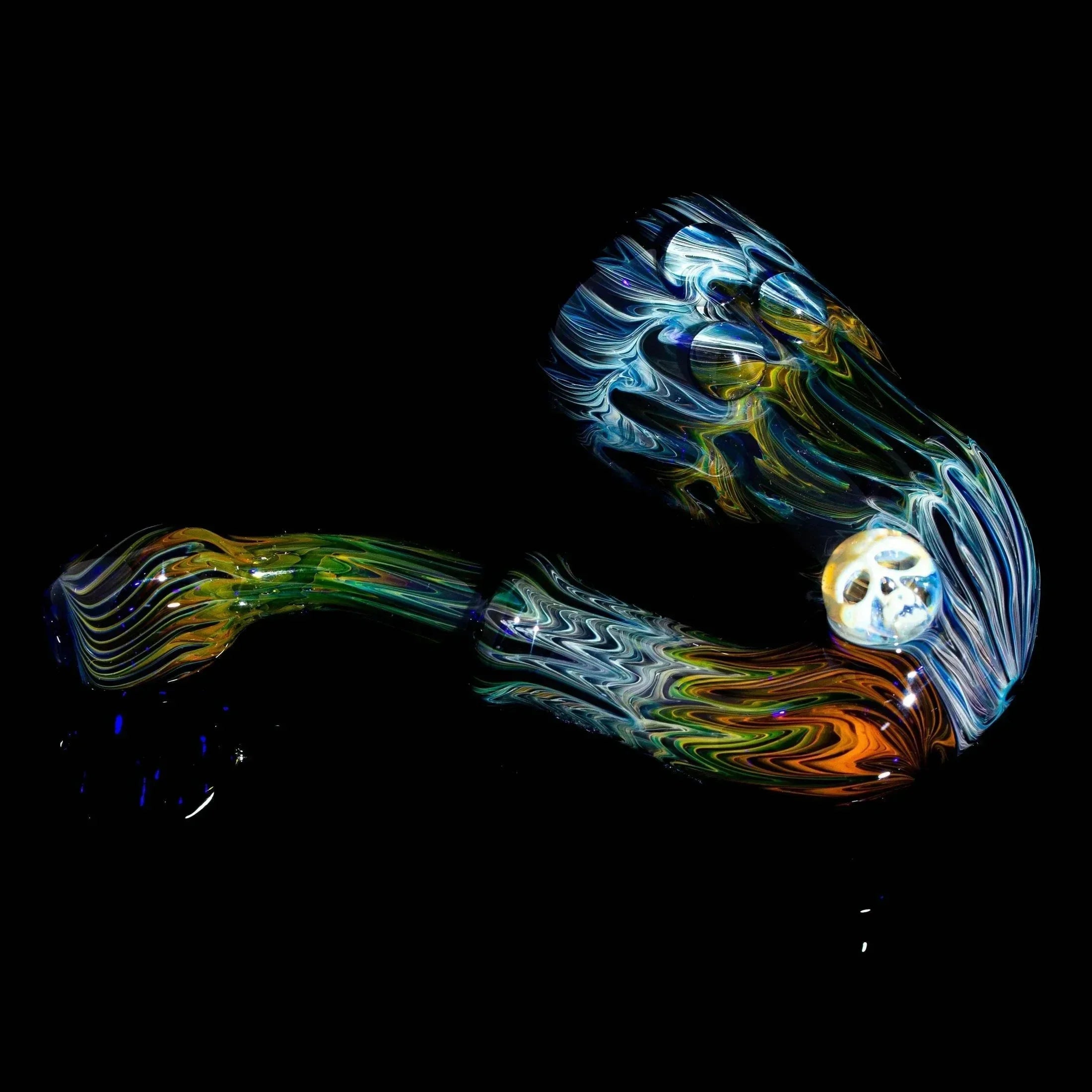Colorful glass Sherlock pipe with skull detail on black background